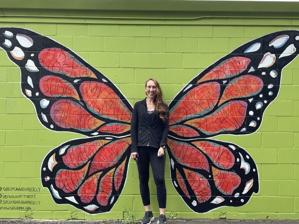 Picture of Kasey with butterfly wall